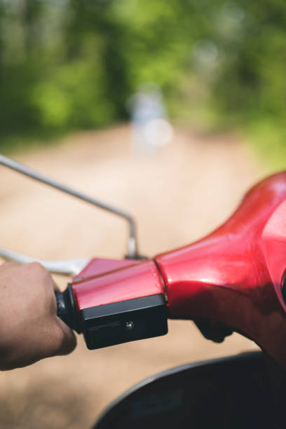 istock Man riding scooter - person of view perspective 670008592
