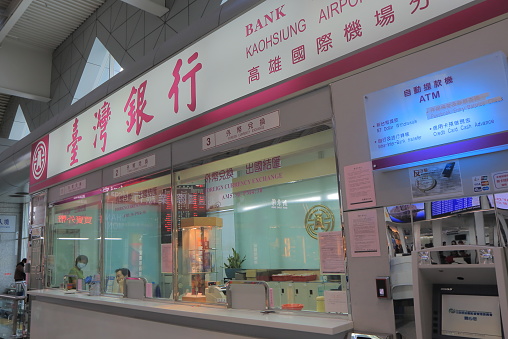 Kaohsiung Taiwan - December 16, 2016: Bank of Taiwan at Kaohsiung International Airport in Kaohsiung Taiwan. Bank of Taiwan is a bank headquartered in Taipei Taiwan administered and owned by the Executive Yuan of Taiwan.