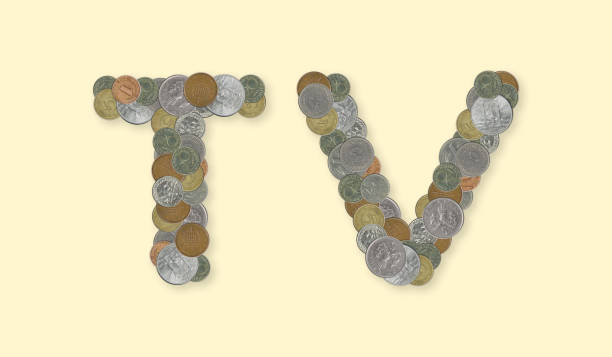 istock TV  – Coins on yellow background 670014890