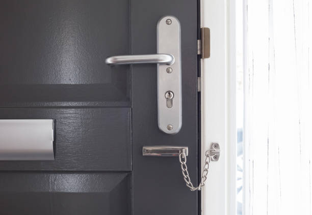 istock Door chain on a grey door 670018790