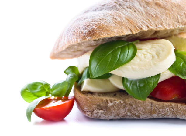 istock Ciabatta with mozzarella, tomato and basil isolated on white 670019260
