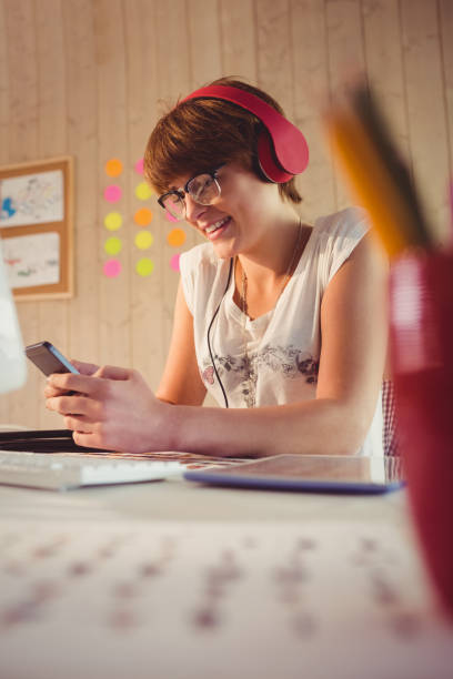 istock Casual businesswoman using her smartphone 670019640