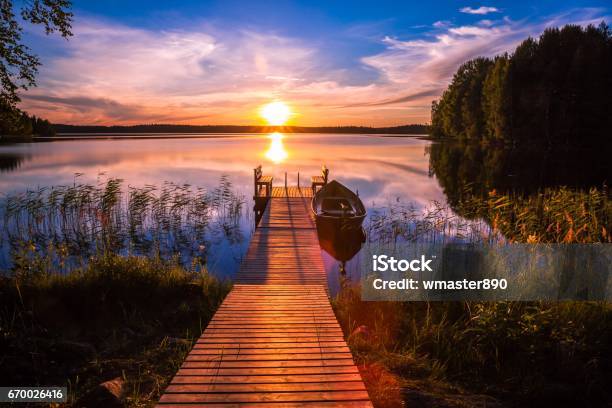 Sunset Over The Fishing Pier At The Lake In Finland Stock Photo - Download Image Now