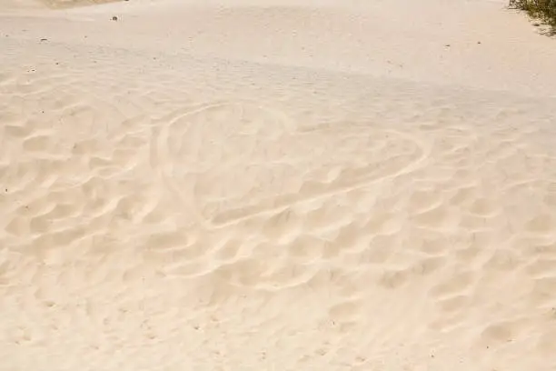 Mesquite Flats Sand Dunes in the northern point of the Dead valley in heat, made of fine quartz sand, a heart is painted in the sand