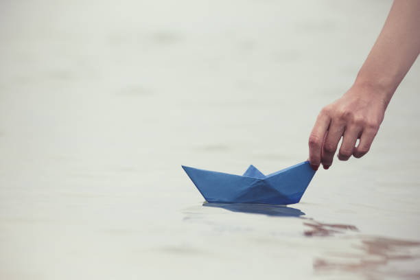 istock Paper boat in female hand 670026970