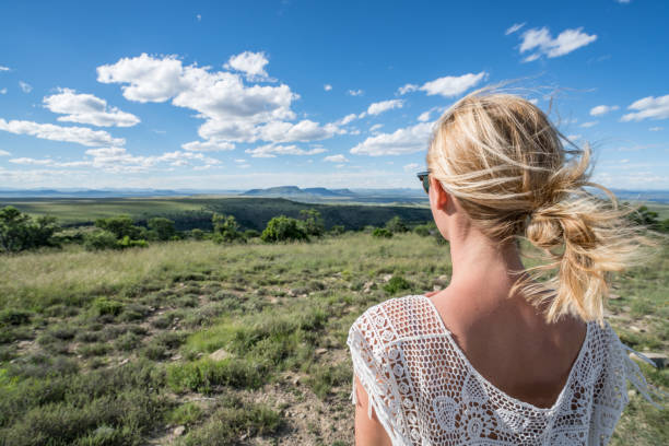 istock Young woman looking at spectacular mountain scenery 670032194
