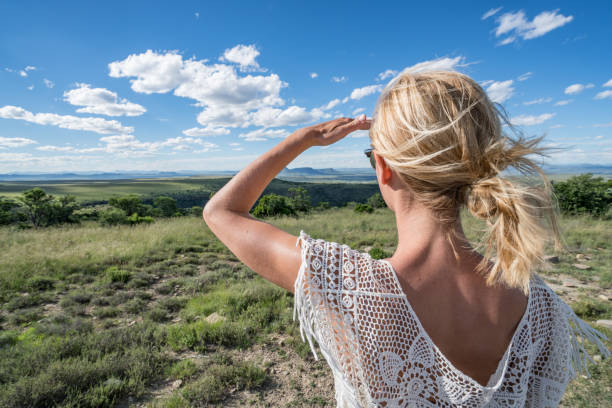 istock Young woman looking at beautiful view, South Africa 670032196