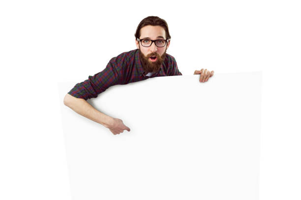 istock Handsome hipster showing large poster 670032668