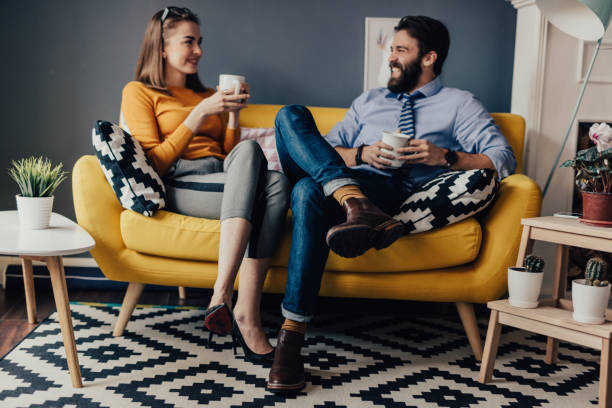 istock Two colleagues drinking coffee in a break room 670033146