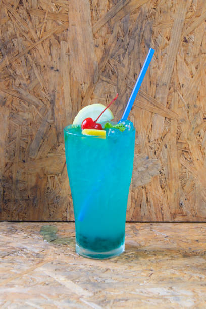 istock Blue lemon soda drinking on wood background 670033322