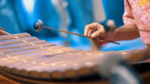 Musician playing Thai xylophone in Orchestra Traditional Music