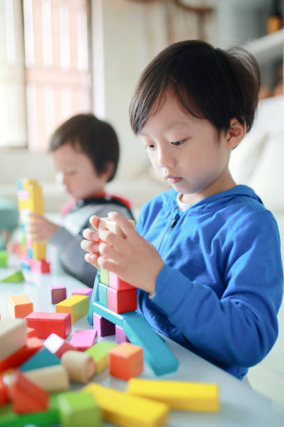 istock Cute asian Children playing with blocks 670036902
