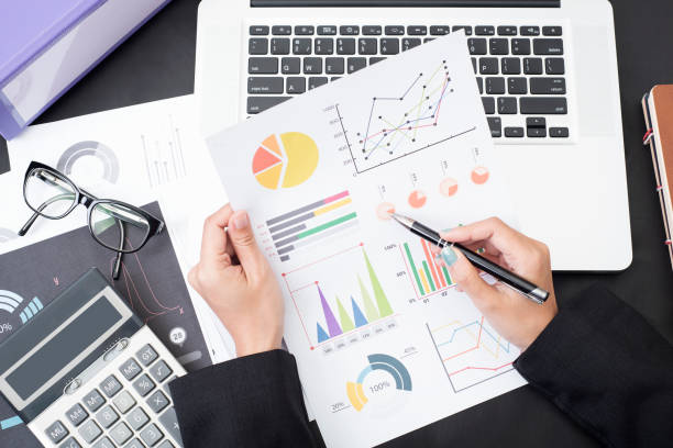 istock business accountant with document graph financial on office table. concept planning budget and audit. 670043888