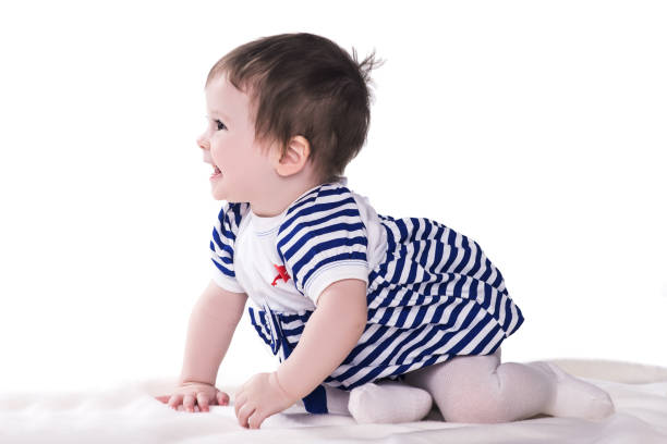 istock baby girl crawling and laughing, isolated on white 670044174