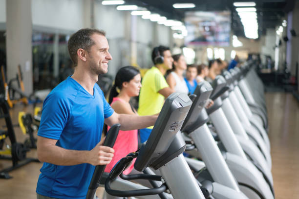 istock People at the gym exercising on cross trainers 670044938