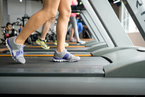 istock People at the gym running on the treadmills 670045014