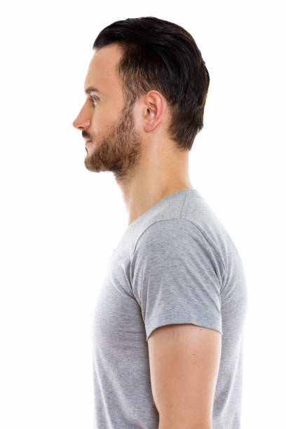 istock Profile view of young handsome man against white background 670045568