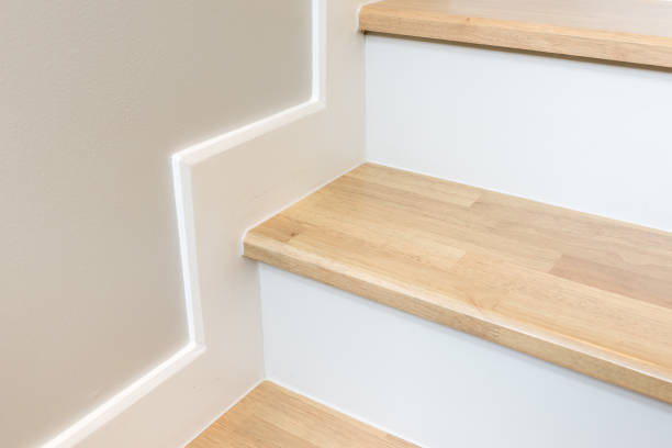 istock modern stair design with wooden tread and white riser 670050656