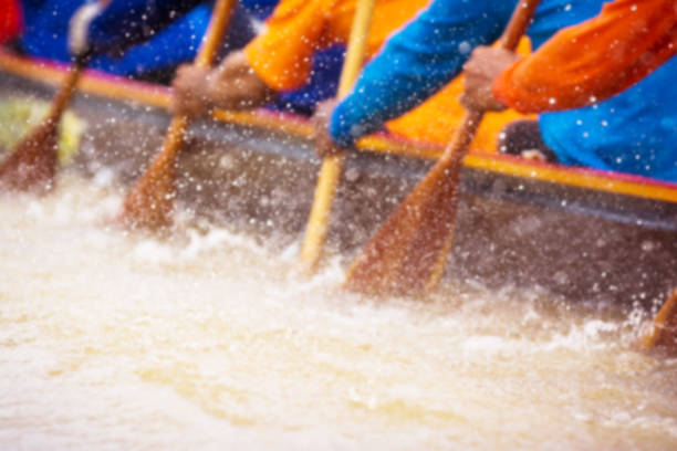 istock Close up of rowing team race 670054292