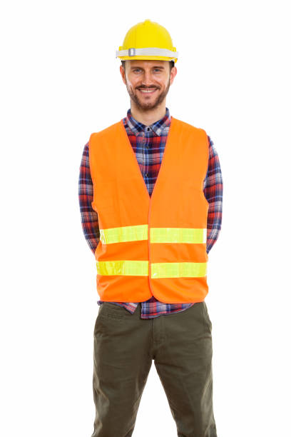 istock Studio shot of happy young man construction worker smiling while standing 670056334