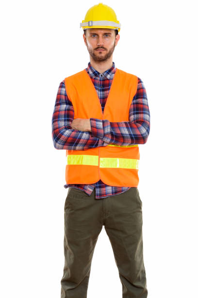 istock Studio shot of young man construction worker standing with arms crossed 670060490