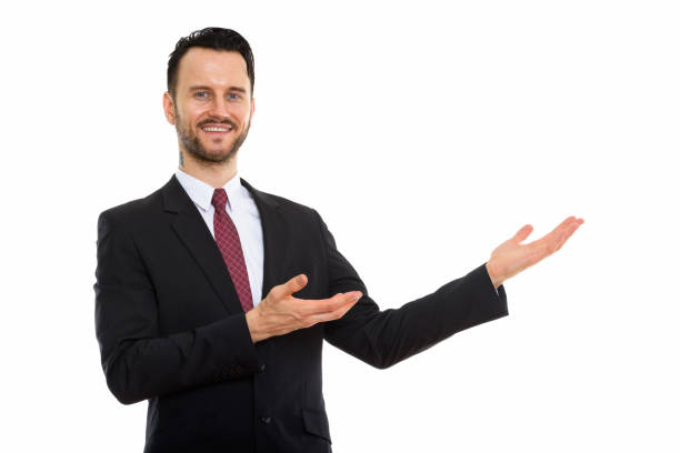 istock Studio shot of young happy businessman smiling while showing something 670061262