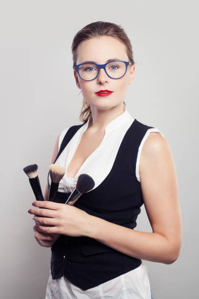 istock Woman Makeup Artist with Make-up Brush 670065222
