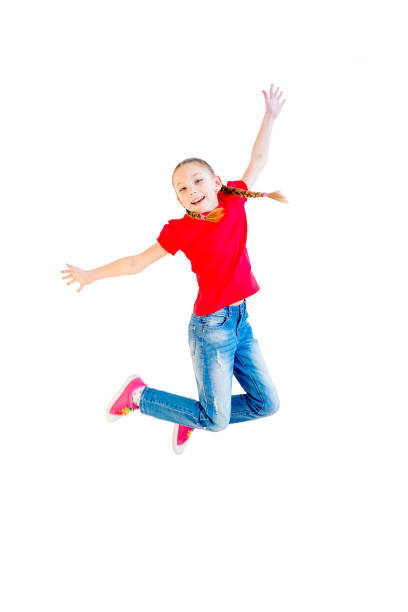 istock Happy girl jumping 670065736