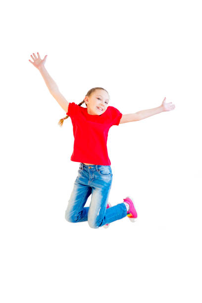 istock Happy girl jumping 670065832