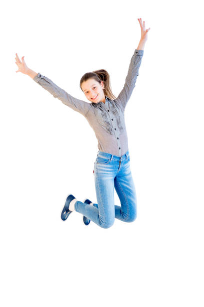 istock Happy girl jumping 670065994
