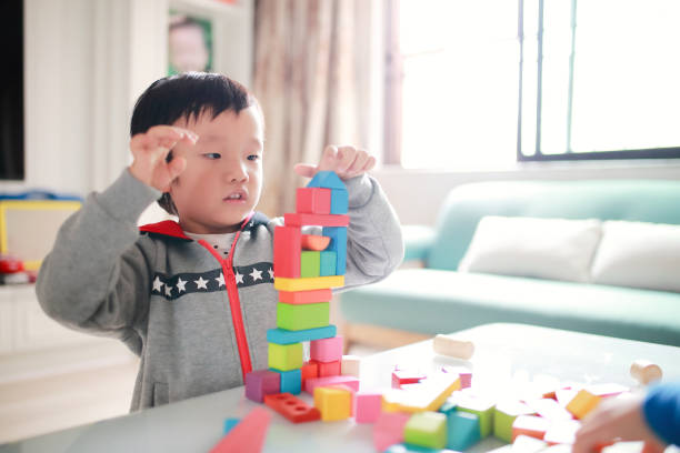 istock Cute asian Children playing with blocks 670068746