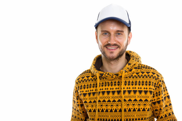 istock Studio shot of happy young man smiling while wearing hat 670072462