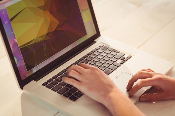 istock Businesswoman using her laptop at desk 670076088