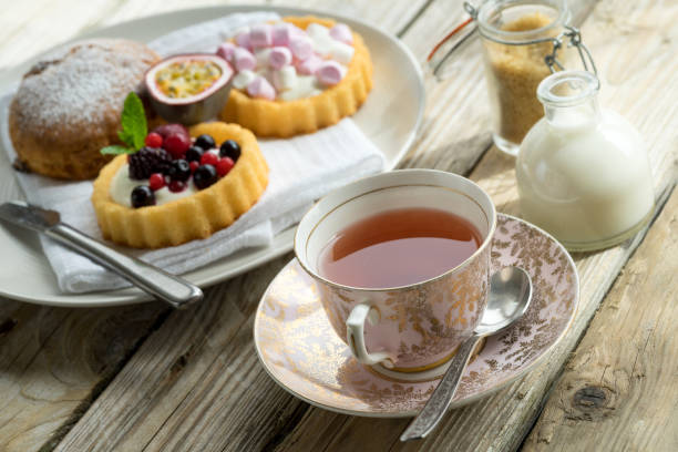 afternoon tea party old school style tea at five afternoon service set cake sweet traditional table hotel cheesecake sugar pot china cup tea party horizontal nobody indoors stock pictures, royalty-free photos & images