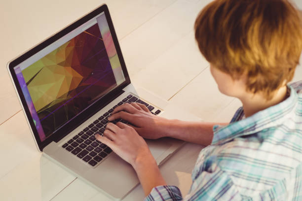 istock Businesswoman using her laptop at desk 670076428