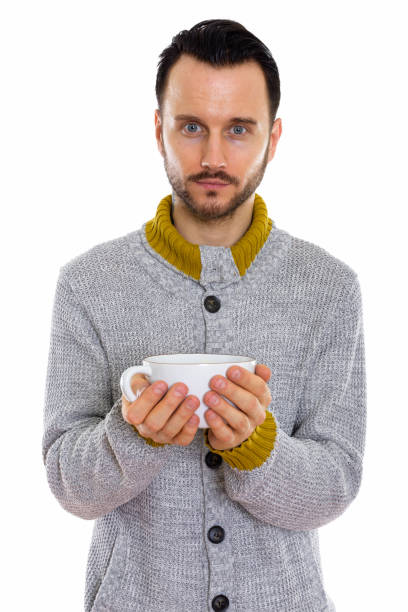 istock Studio shot of young man holding coffee cup 670083714