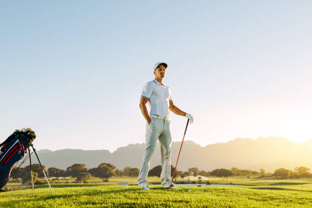 istock Caucasian male golfer standing on golf course 670084362