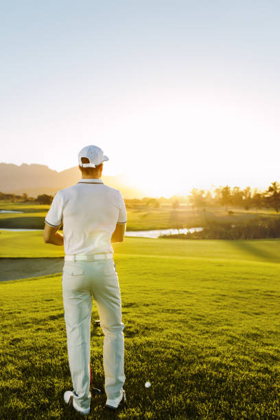 istock Male golfer standing at tee square on course. 670084584
