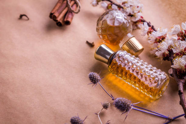 istock Bottles of perfume with ingredients 670089834
