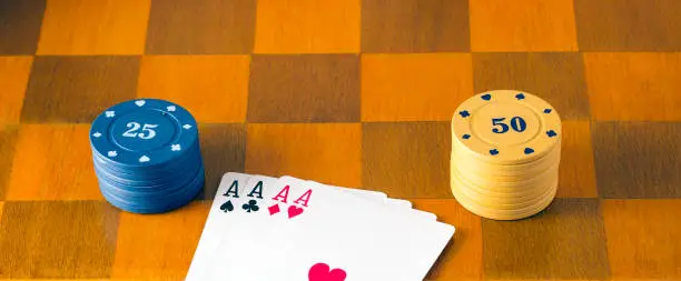 Photo of Four aces on a chessboard