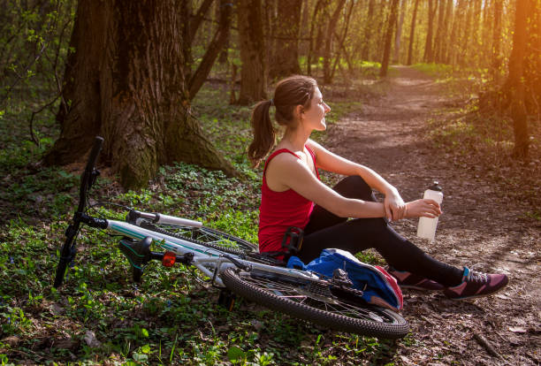istock Young woman having a rest after riding a bicycle 670095228