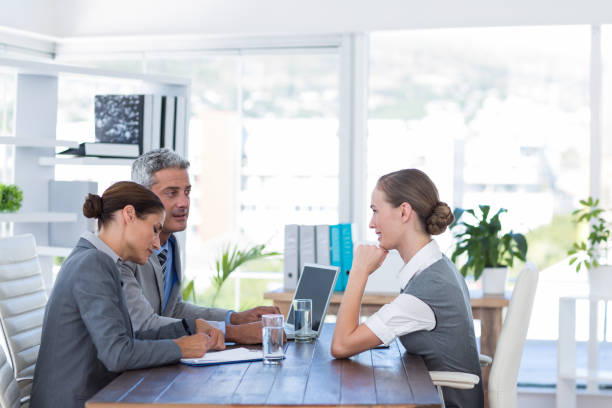 istock Business people interviewing young businesswoman 670096808