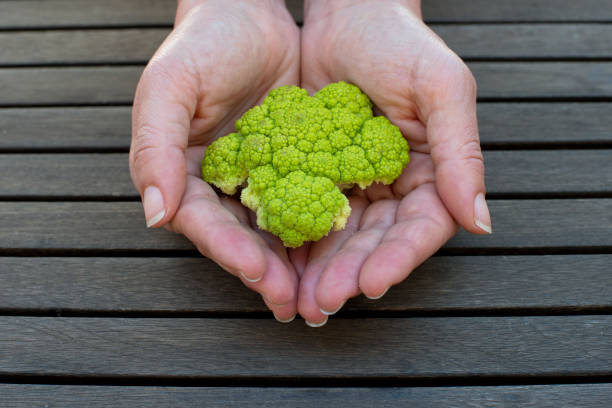 Broccoli Broccoli on wooden background comida italiana stock pictures, royalty-free photos & images