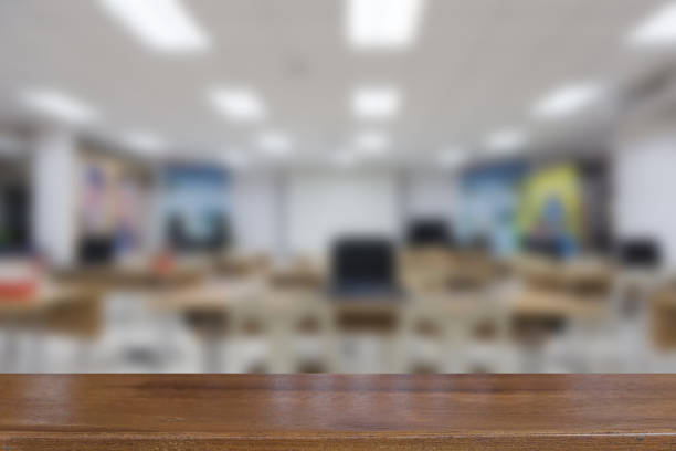 istock Computers study room at the university or college, blur background with selective focus wood table for display your product 670101930