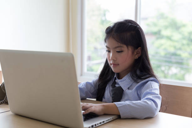istock asian student girl learning, studying online using laptop computer in room 670101958