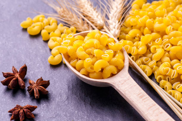 istock Raw pasta and ears of wheat 670109146