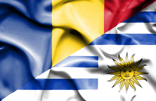 istock Waving flag of Uruguay and Romania 670112756