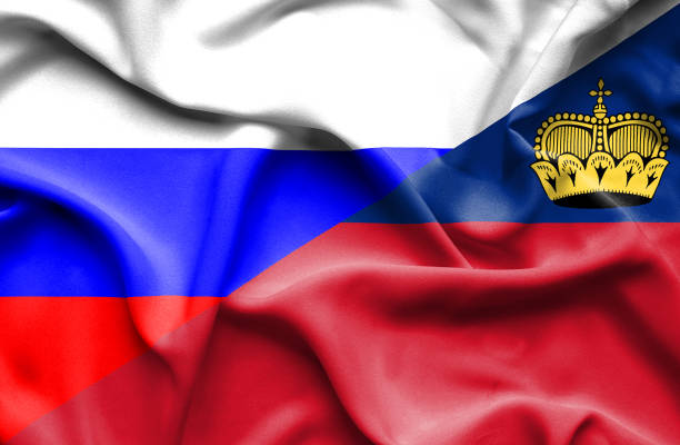 istock Waving flag of Lichtenstein and Russia 670113112