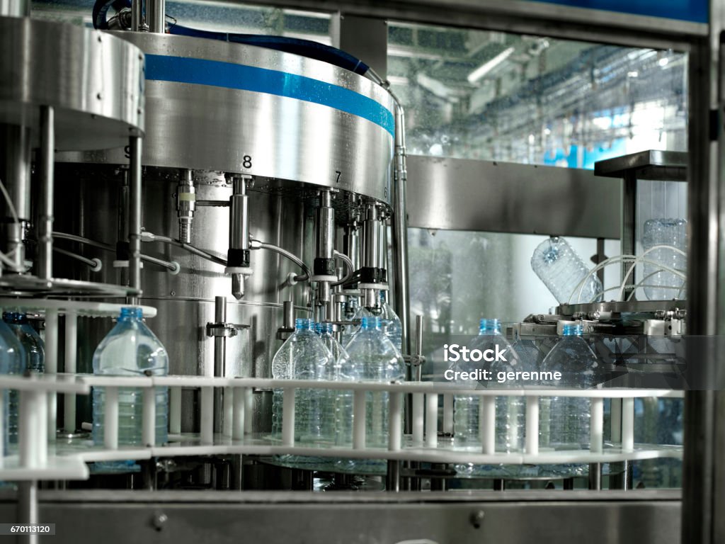 water bottling factory machinery in water bottling factory Machinery Stock Photo