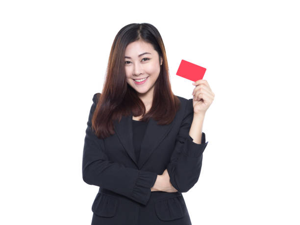 istock woman smiling holding card on white background 670113282